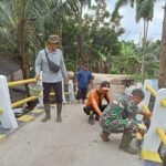 Satgas TMMD Kodim 0314/Inhil Jaga Kualitas dan Estetika, Pengecatan Jembatan Jadi Sentuhan Akhir