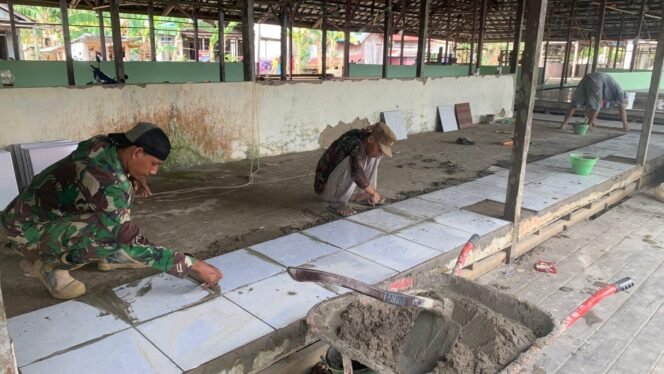 
					Pemasangan Keramik di Pasar Desa Talio Capai Separuh Lantai, Progres TMMD Terus Meningkat