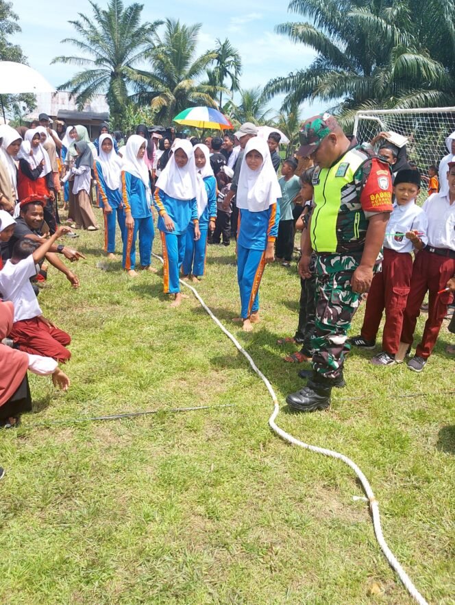 
					‎Babinsa Koramil Woyla Barat Kawal Kegiatan HUT RI ke-80 di Desa Pasi Mali