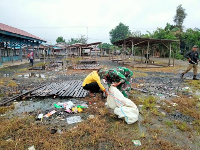 
					Pasar Lama Disulap Jadi Ruang Bersih: Koramil Belawang Pimpin Aksi Karbak