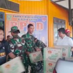 Koramil 0909-01/Sangatta Turun Langsung Dampingi Penyaluran Logistik Banjir