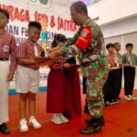 Babinsa Hadiri Penutupan O2SN dan FLS2N SD/MI Kecamatan Delta Pawan 2026